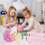 ADORA Rainbow Hugs Doll Set! Realistic 13″ Doll and Nurturing Set with Accessories That Includes Crib Box, Rainbow-Print Onesie, Beanie, Pacifier, Diaper, Magic Milk Bottle and Blanket